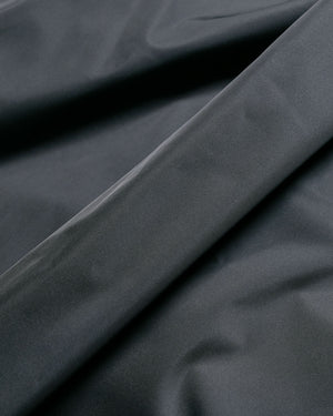 Auralee Hard Twist Polyester Satin Laminate Field Pants Black fabric