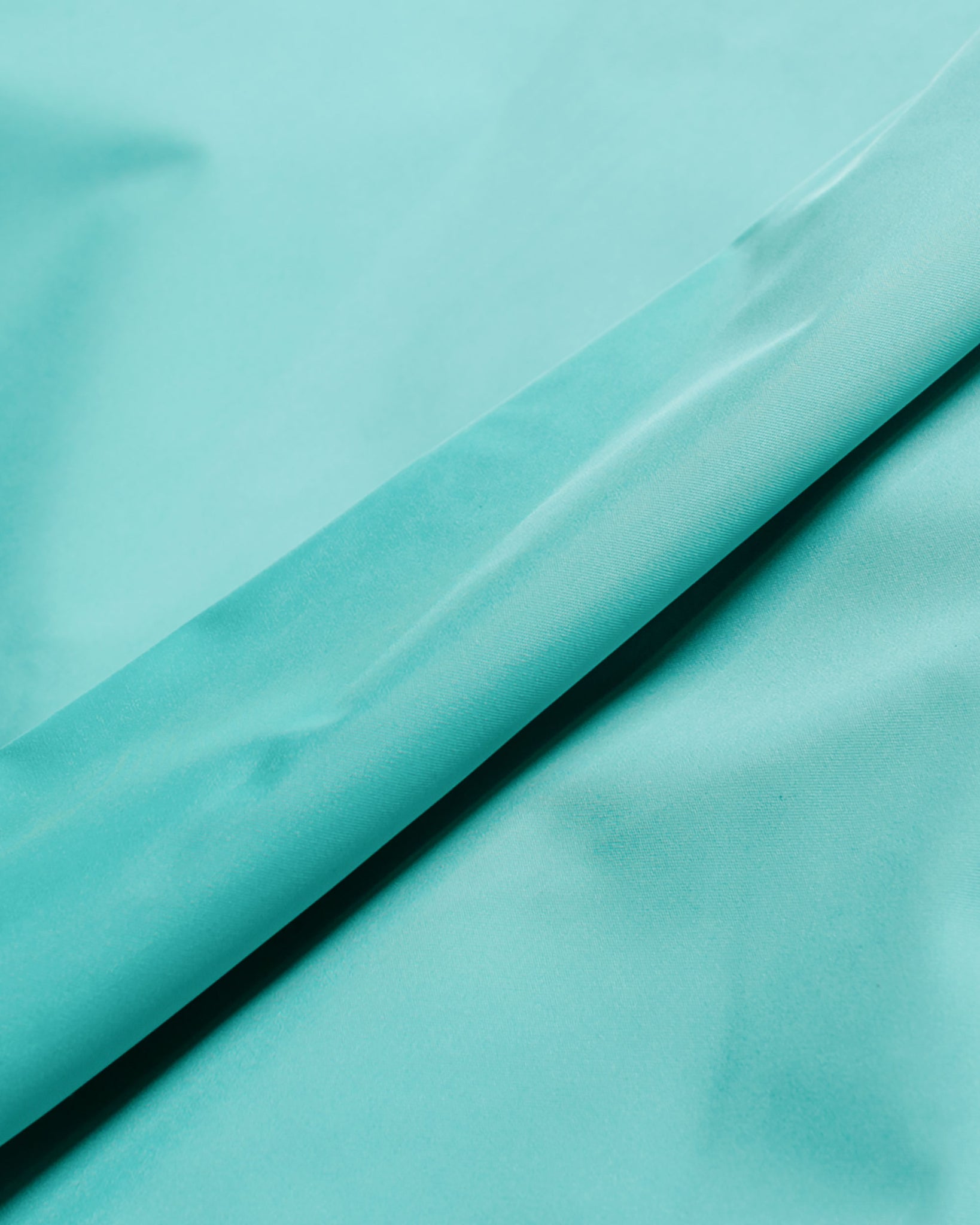 Auralee Hard Twist Polyester Satin Laminate Field Pants Turquoise Blue fabric