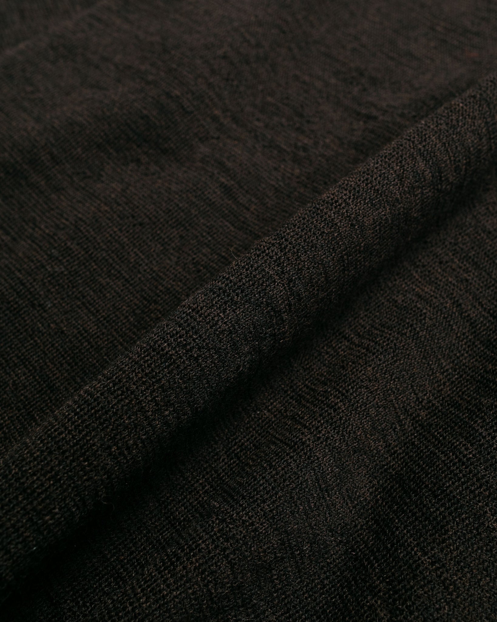 MHL Oversized Knitted Polo Dry Wool Ebony fabric