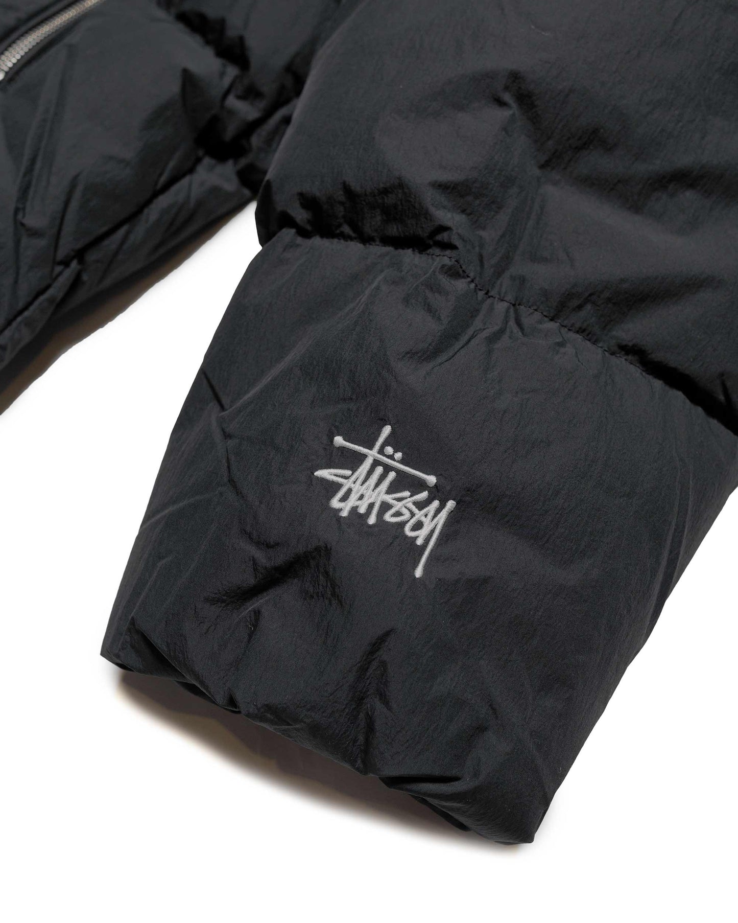 Stüssy Nylon Down Puffer Black sleeve